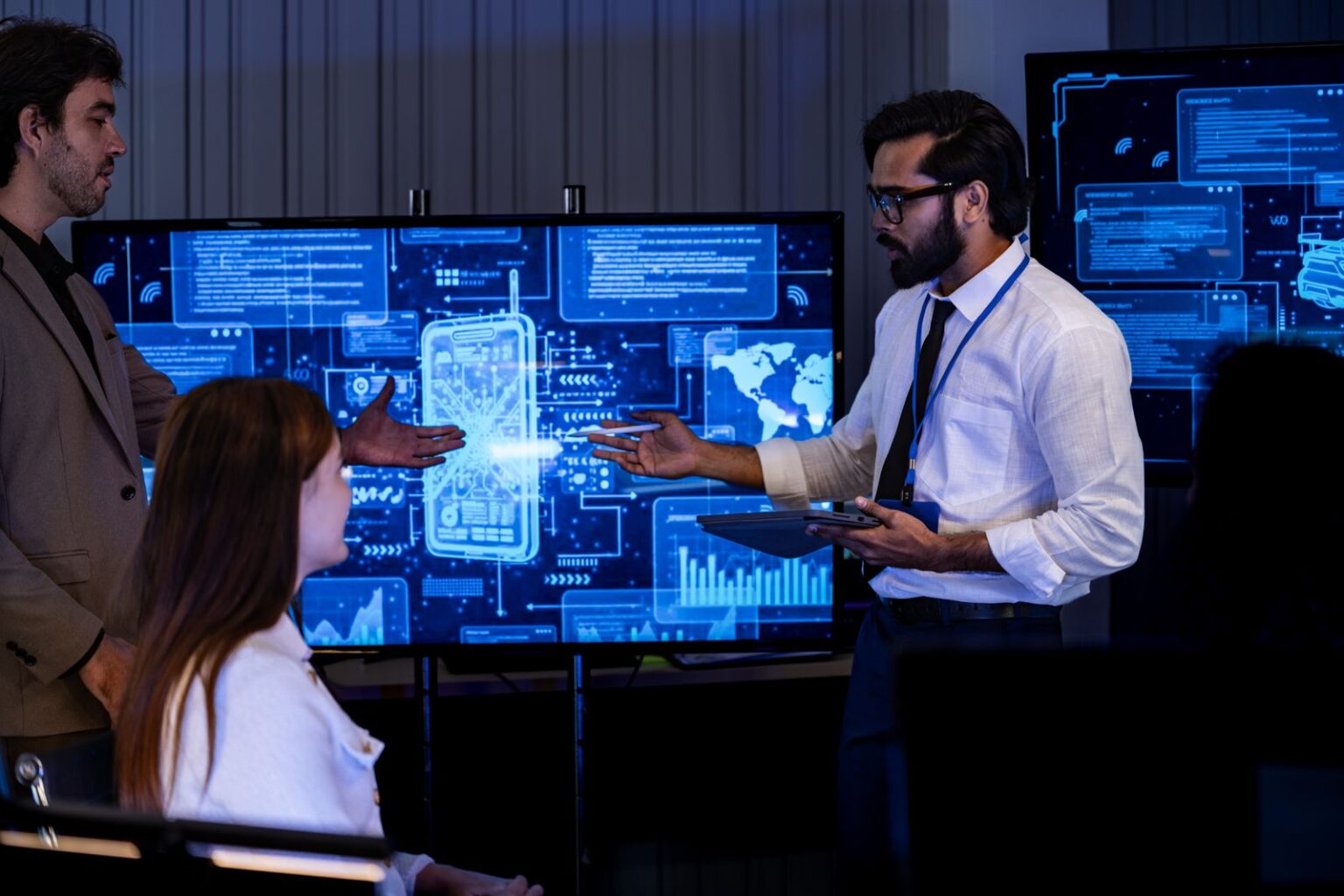 Professional team collaborating on data analysis screens for an AI automation project