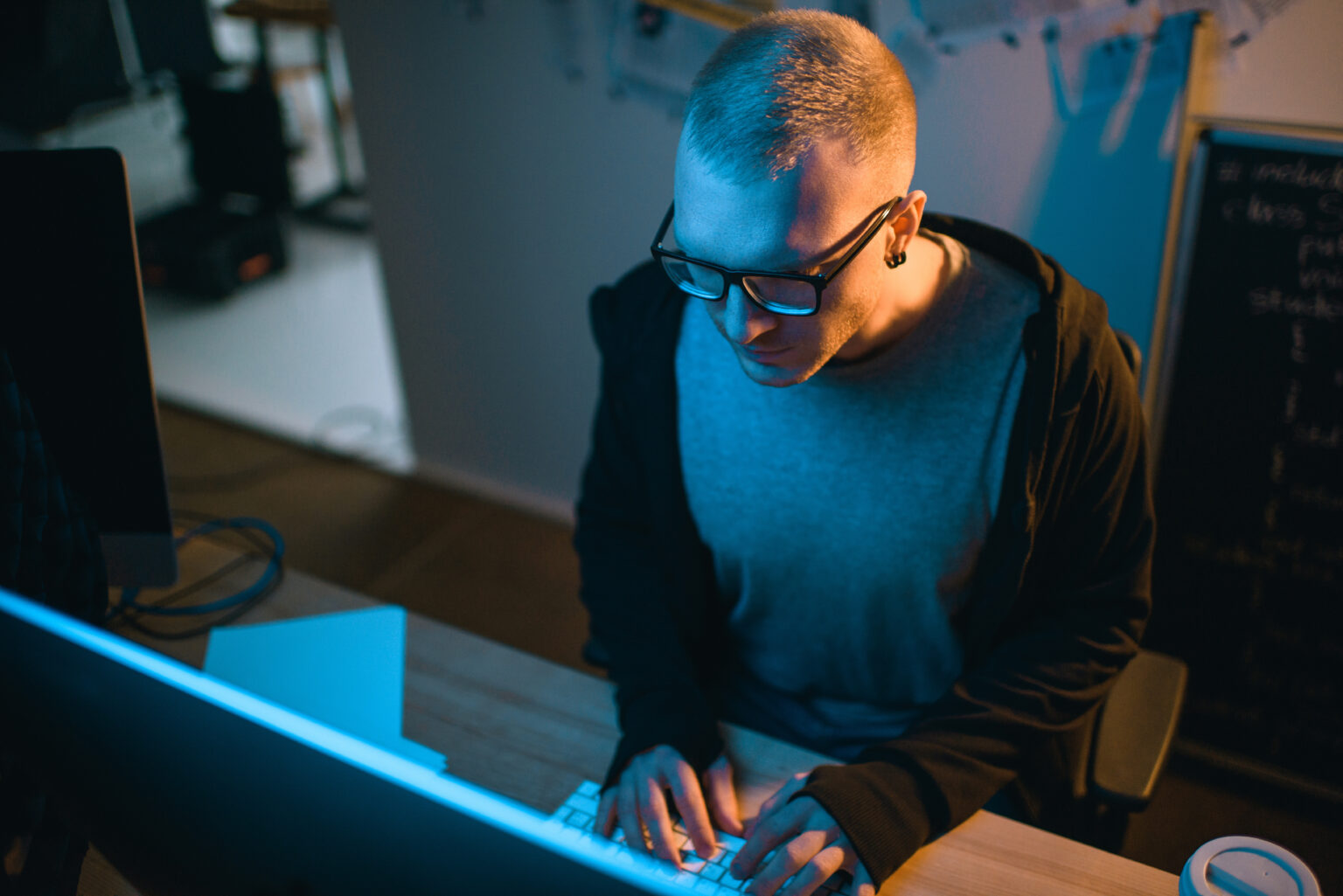 Mobile app engineer writing code for an iOS and Android release